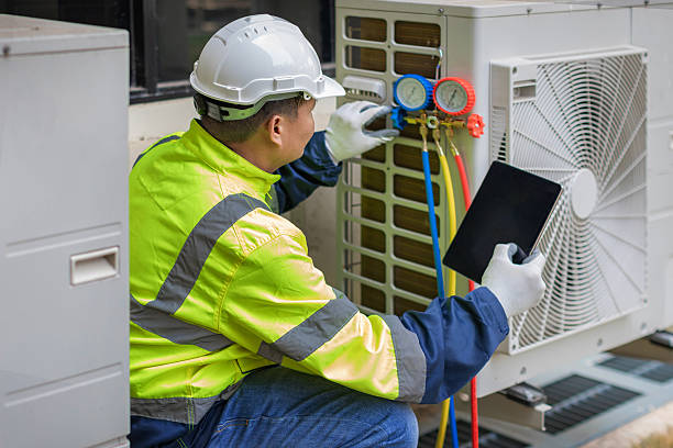 Professional Air Conditioning Repair technician working in La Marque, TX